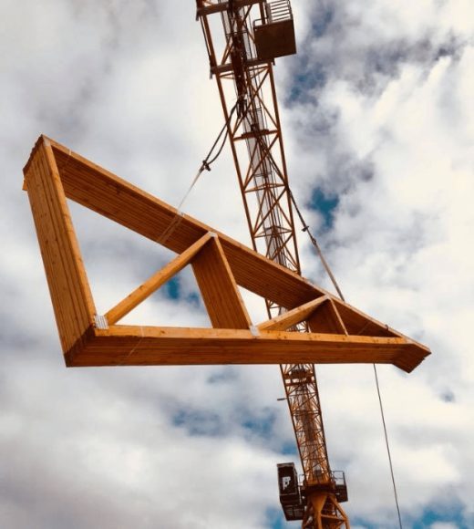 Image-of-a-yellow-crane-loading-wooden-materials-to-the-top-of-a-roof-qg49idtnmxduxs42z1xmomipnvsqj6eoxhoi9na9bc Image-of-a-yellow-crane-loading-wooden-materials-to-the-top-of-a-roof-qg49idtnmxduxs42z1xmomipnvsqj6eoxhoi9na9bc